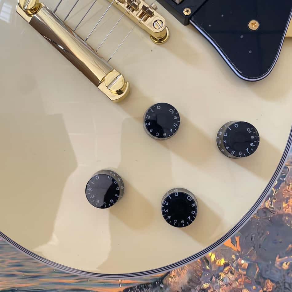 Electric Guitar Beginner - Ivory-white electric guitar with a rectangular